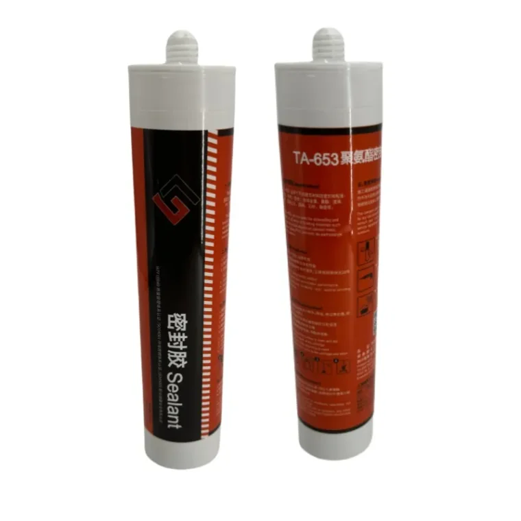 Applying white polyurethane caulk sealer to window gaps